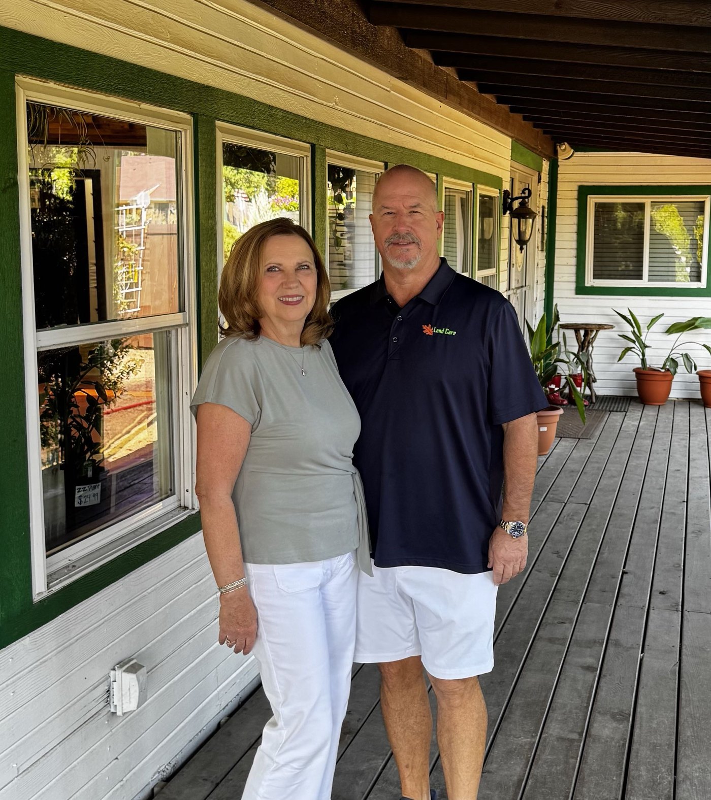 Steve and Karen Cammack standing together outside Land Care Garden Center in Flower Mound, TX