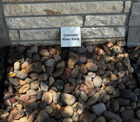 Colorado River Rock decorative stone sample on display at Land Care Garden Center in Flower Mound, TX