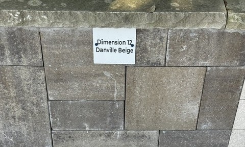 Dimension 12 Danville Beige cut stone sample on the building stone display wall at Land Care Garden Center in Flower Mound, TX