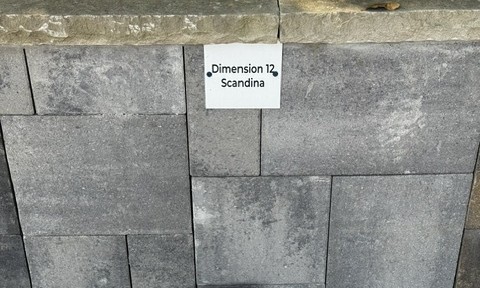Dimension 12 Scandina cut stone sample on the building stone display wall at Land Care Garden Center in Flower Mound, TX