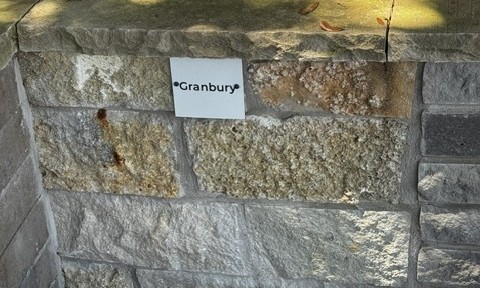 Granbury chopped stone sample on the building stone display wall at Land Care Garden Center in Flower Mound, TX
