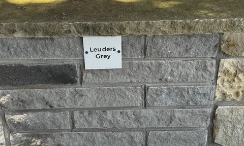 Leuders Grey chopped stone sample on the building stone display wall at Land Care Garden Center in Flower Mound, TX