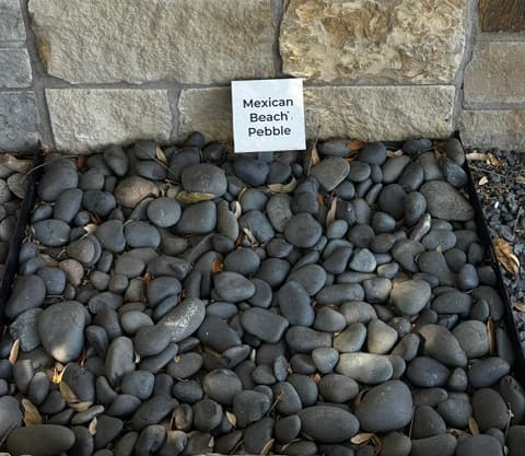 Mexican Beach Pebble decorative stone sample on display at Land Care Garden Center in Flower Mound, TX