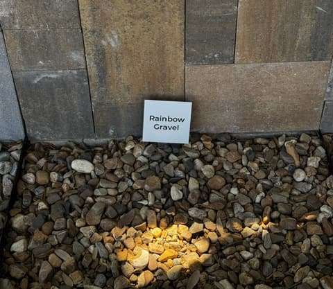 Rainbow Gravel decorative stone sample on display at Land Care Garden Center in Flower Mound, TX