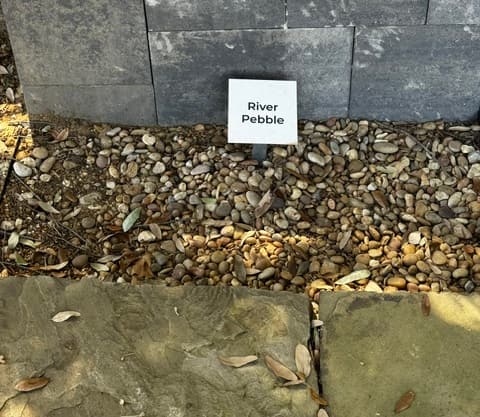 River Pebble decorative stone sample on display at Land Care Garden Center in Flower Mound, TX