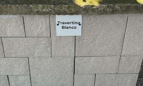 Travertino Blanco cut stone sample on the building stone display wall at Land Care Garden Center in Flower Mound, TX